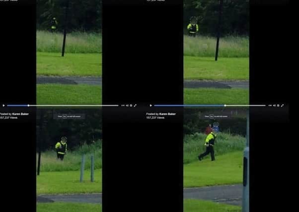 Still of video posted on Facebook site of Karen Baker showing officer emerging from the long grass after seemingly relieving himself