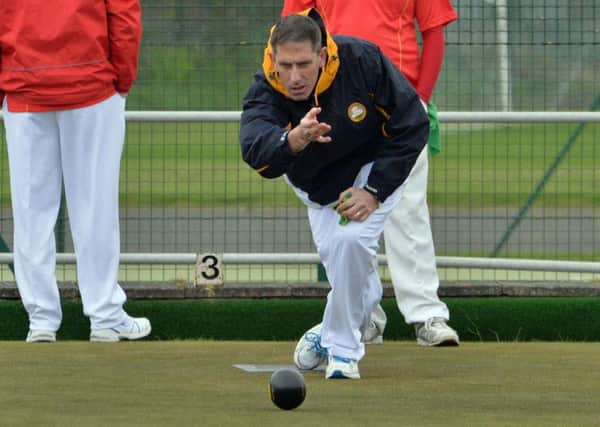 Martin McHugh bowling for Whitehead