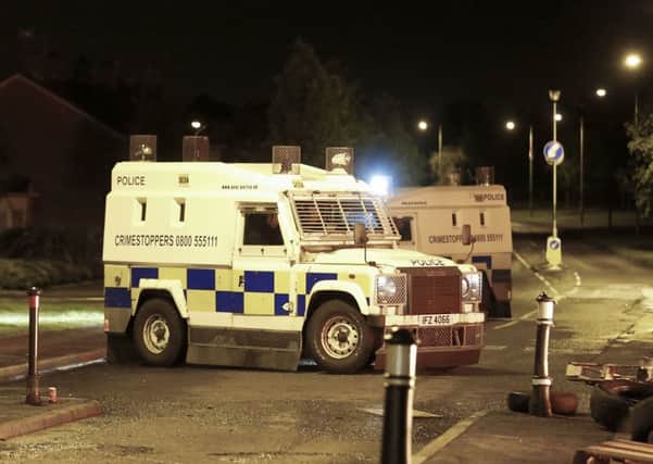 Police at the scene of disturbances in Carrickfergus in early July