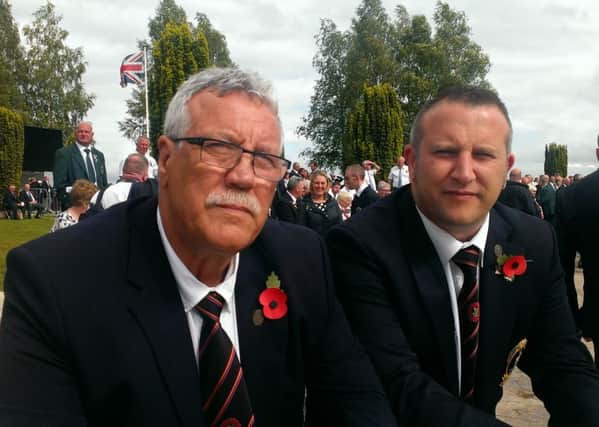 John Currans, left, whose great uncle lost two sons in World War I, including a son who died on the first day of the Somme, pictured with his son John Junior at the Ulster Memorial Tower, Thiepval, on the 100th anniversary of the start of the Battle of the Somme, July 1 2016. By Ben Lowry