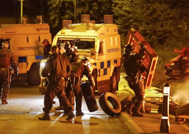 Police officers in riot gear deal with disturbances in the Woodburn and the Castlemara estates in Carrickfergus