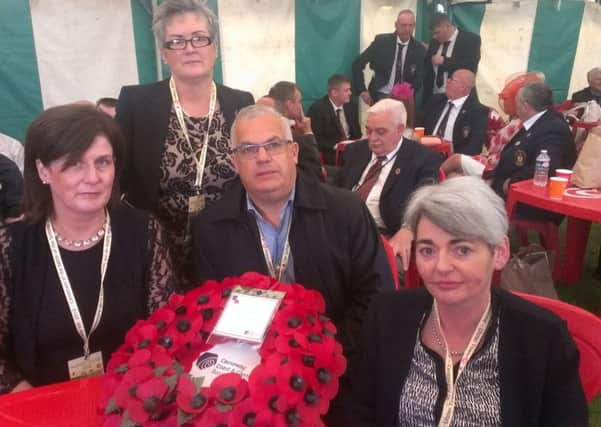 SDLP councillors shelter from the rain at the Ulster Memorial Tower, Thiepval, from left, Roisin Loftus (Causeway Coast and Glens), Christine McFlynn (Mid Ulster), Tim Attwood (Belfast) and Rosemary Sheilds (Fermanagh and Omagh) on the 100th anniversary of the start of the Battle of the Somme, July 1 2016. By Ben Lowry