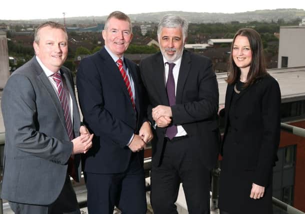 Housing Executive CEO Clark Bailie, second right, with  CTS Projects Asst MD Serena Hylands and NIHE directors Paul Isherwood, asset management, left, and Gerry Flynn, housing services