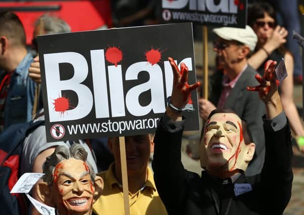 Protesters outside the Queen Elizabeth II Conference Centre, London, where the publication of the Chilcot inquiry into the Iraq War is taking place