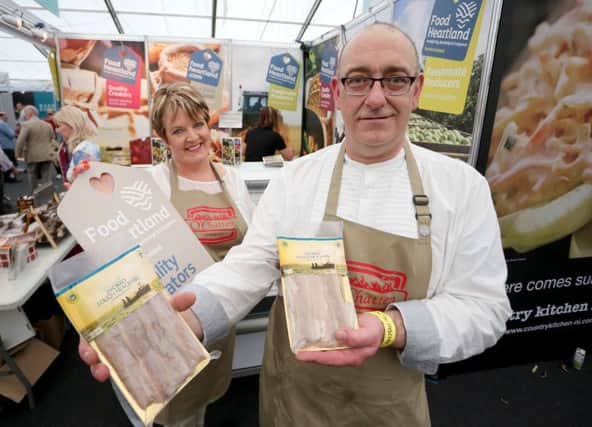 Owner Andrew Chatten (right) and business partner Frances O'Hagan (left) at the Food Heartland stand at the Balmoral Show 2016