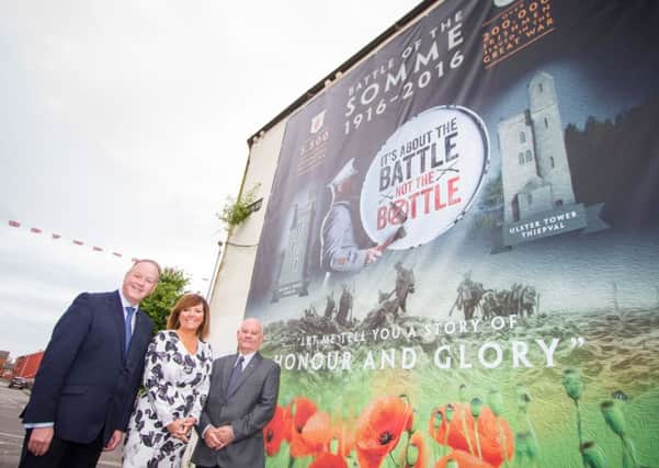 Pictured at the mural unveiling are (L-R) William Humphrey MLA; Jennifer Hawthorne, Housing Executive Head of Communities; and Billy Mawhinney, co-ordinator of Belfast Orangefest