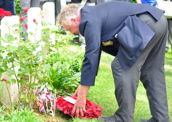 Joe McBride lays a wreath for his uncle Willie McBride