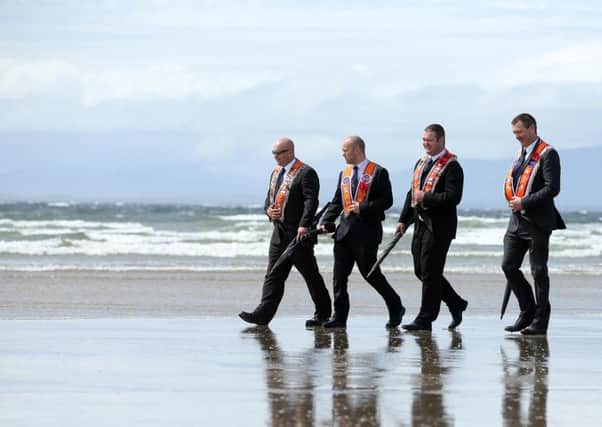 Marchers take part in the annual Rossnowlagh orange parade in County Donegal