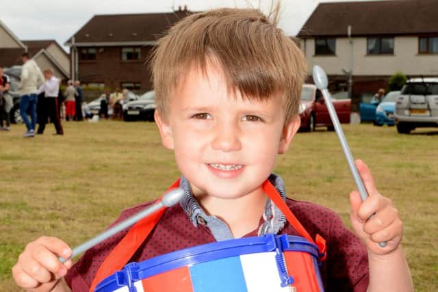 Three year old Jake Dunne, created his own style of drumming at the Flagship Twelfth in Kilkeel. Â© Photo: Gary Gardiner.