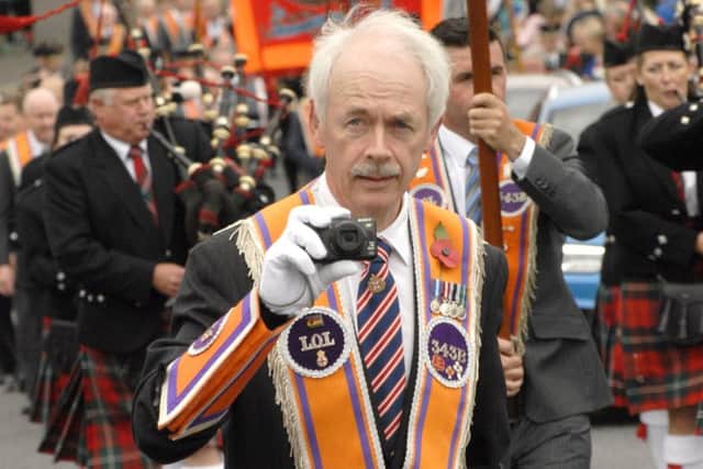 Watching us watching you.....One of the Brethren of Aughnahoory Heroes LOL No. 343B, films the Mourne District LOL No.6 Flagship Twelfth Demonstration, while on parade in Kilkeel.  Â© Photo: Gary Gardiner.