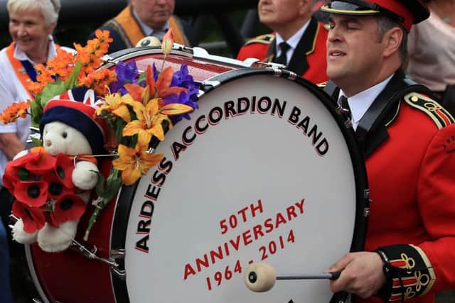 The bass drummer with Ardess Accordion Band keeping in tune