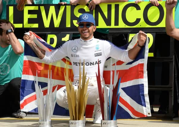 Mercedes' Lewis Hamilton celebrates winning the 2016 British Grand Prix at Silverstone