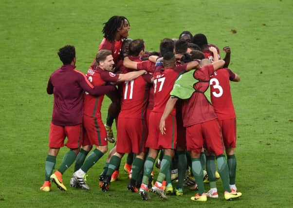 Portugal players celebrate at full time after winning the UEFA Euro 2016 Final at the Stade de France