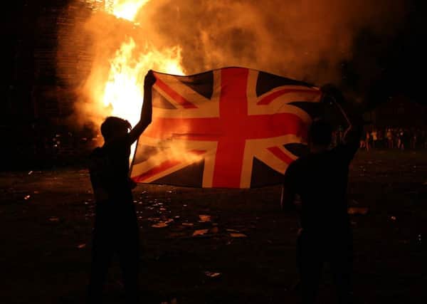 The huge bonfire  in the Shankill Road in Belfast  is lit on the "Eleventh night" to usher in the Twelfth commemorations