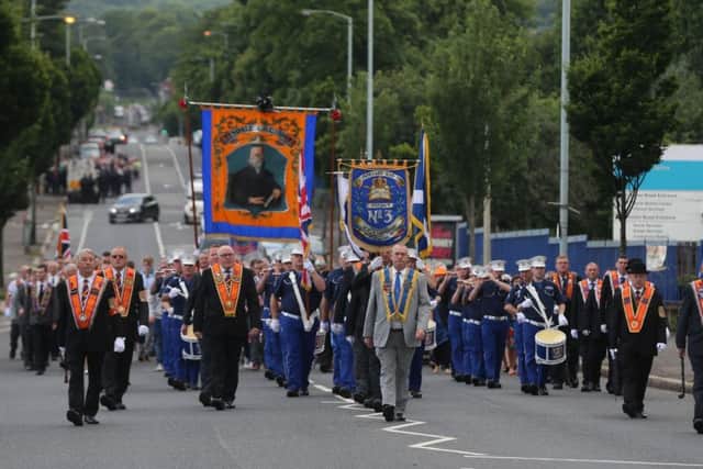 Orangemen march down the Crumlin Road in Belfast during one of the annual Twelfth of July parades across Northern Ireland