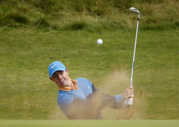 Northern Ireland's Rory McIlroy plays out of a bunker on the postage stamp 8th hole