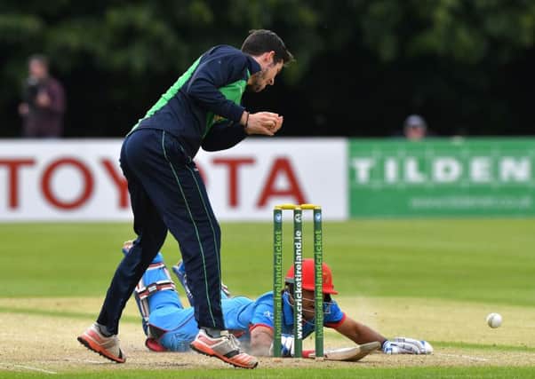 Najibullagh Zadran, Afghanistan, just makes his ground as George Dockrell fails to get a run-out