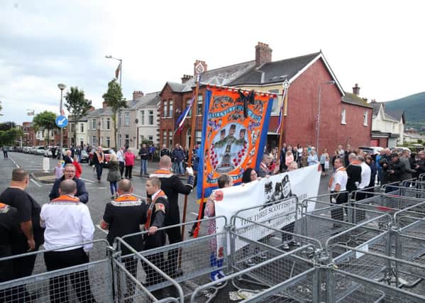 Members of the Orange Order pictured at a PSNI barrier at the Woodvale Road in North Belfast after the main 12th of July parades took place across Northern Ireland.

Photo by Kelvin Boyes / Press Eye.