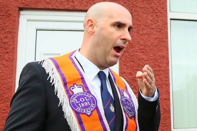 Gerald Solinas hands over a letter of petition at the contentious orange order parade gathers at the stoping point on the Woodvale road during July 12th celebrations in Belfast , 2016 ( Photo by Kevin Scott / Presseye)