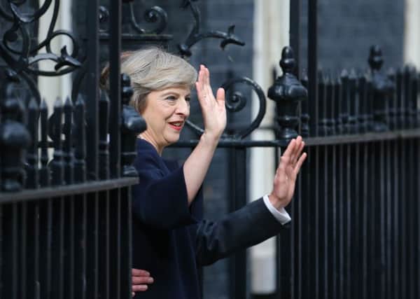 Theresa May arrives in Downing Street. Photo: Gareth Fuller/PA Wire