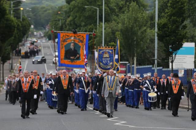 Orangemen march down the Crumlin Road in Belfast during one of the annual Twelfth of July parades across Northern Ireland