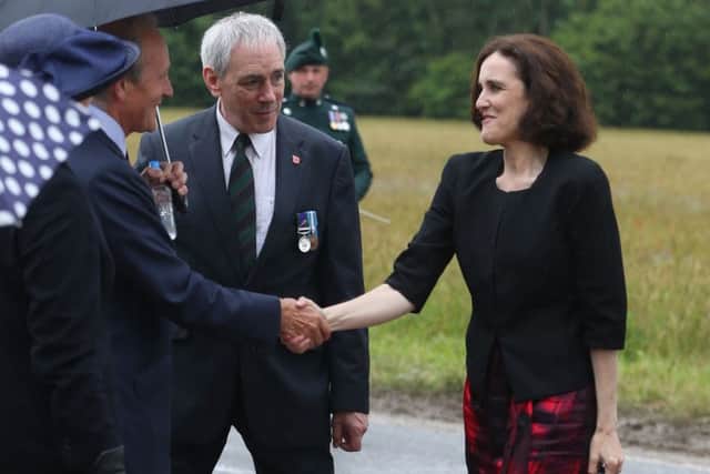 Theresa Villiers meets dignitaries earlier this month at the Ulster Memorial Tower at the Somme. Photo: Niall Carson/PA Wire