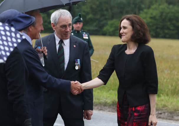 Theresa Villiers meets dignitaries earlier this month at the Ulster Memorial Tower at the Somme. Photo: Niall Carson/PA Wire