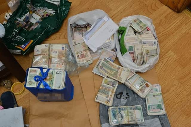 Bundles of cash seized by the PSNI on July 13