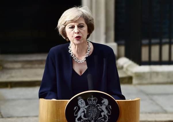 Theresa May addresses the assembled crowd at Downing Street