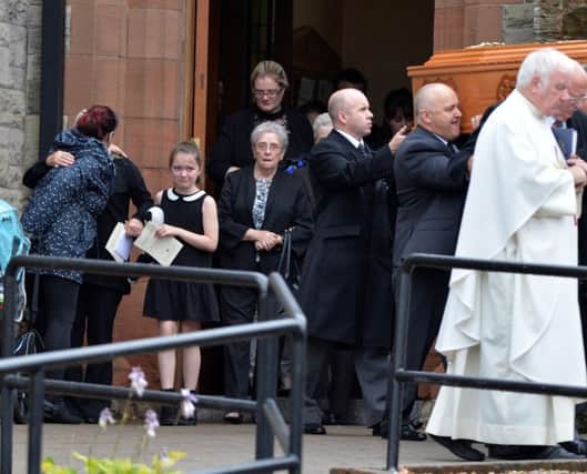 Family and friends after the funeral of Martin Hale at St Patrick's Catholic church in Lisburn