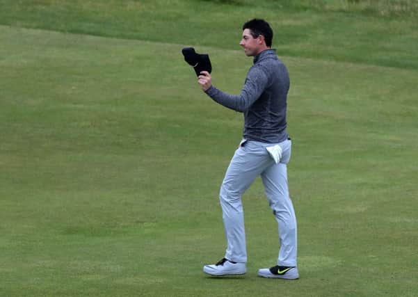 Northern Ireland's Rory McIlroy walks down the 18th during day the final day of the Open Championship