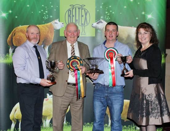 The Brownville flock Bessbrook, currently hold champion flock status within the Irish Beltex Sheep Breeders Club. David Brown and Mark Latimer are pictured being presented with the top award by judges Neale and Janet McQuistin from Stranraer
