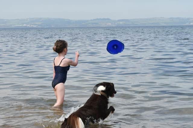 Girl and popper the dog at Helen's Bay. 
Pic Colm Lenaghan/ Pacemaker