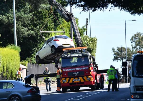 A car is taken away after the crash on the main road between Bangor and Belfast on Tuesday morning near Holywood in which David Catherwood was killed. 
Pic Colm Lenaghan/ Pacemaker