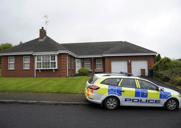 Police at the house in Banbridge where Frank Bratley's body was found