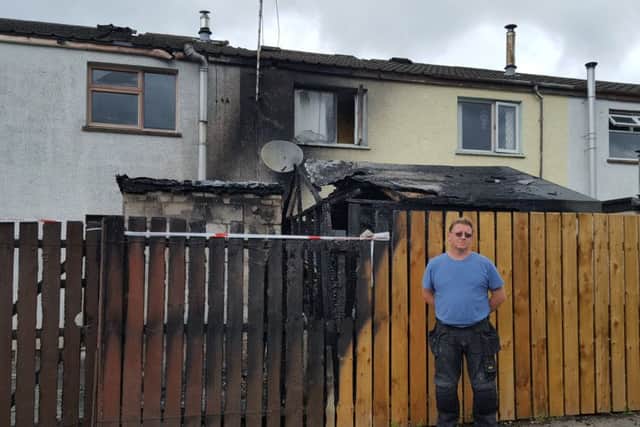 Alex Magee at his Parkmore home which was badly damaged during an overnight blaze