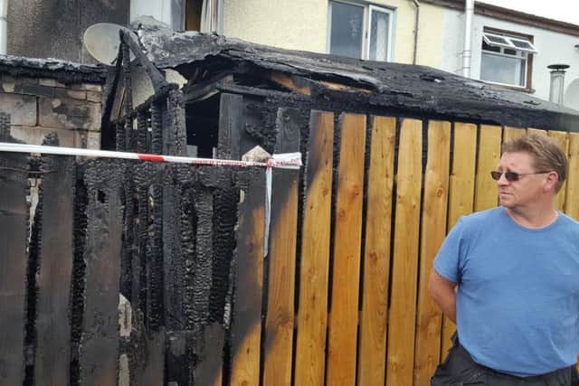 Alex Magee at his Parkmore home which was badly damaged during an overnight blaze
