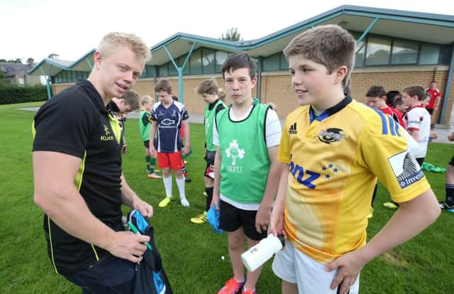 Young players Daniel Ryan Hannah and Peter Baird meet Ulster Rugby player David Shanahan during some time out. Pic:  Matt Mackey / Press Eye