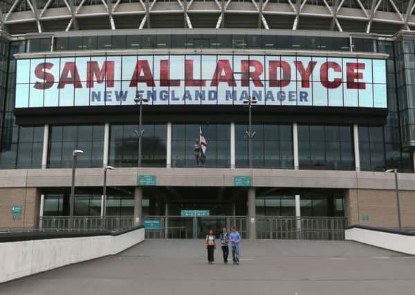 A large digital display reads 'Sam Allardyce New England Manager' at Wembley Stadium