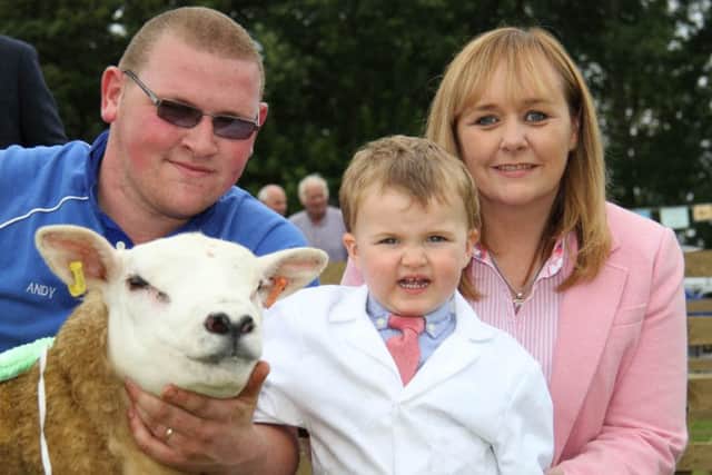 Two-year-old Thomas Hamill was the youngest competitor in the Texel young handlers competition at Antrim Show. Assisted by dad Andrew, he was congratulated by DAERA Minister Michelle McIlveen