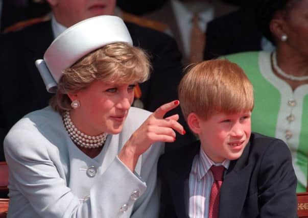 File photo dated 7/5/1995 of the Diana, Princess of Wales with Prince Harry who has said he regrets not opening up sooner about how his mother's death affected him