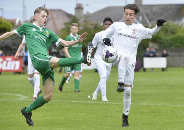 Fermanaghs Josh Largo Elis in action with Strikers Jacob Silva