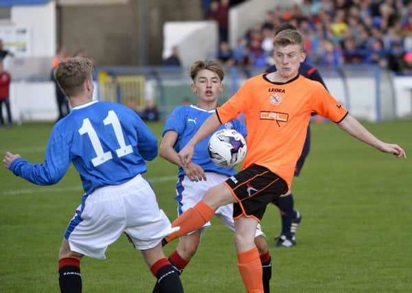 Rangers Billy Gilmour in action with Armaghs Chris Hutchinson