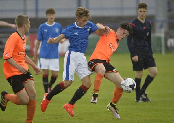 Rangers Billy Gilmour in action with Armaghs Scott McCann