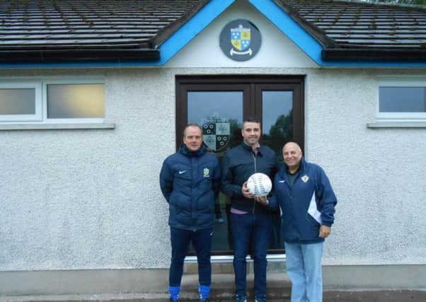 Portadown goalkeeper David Miskelly at Comber Rec with Phil McDonagh (left, manager) and Sammy Haskins (chairman) before this weekend's testimonial celebration.