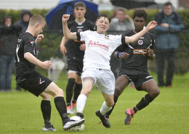 County Armagh's Chris Hutchinson in action with County Tyrone's George Current