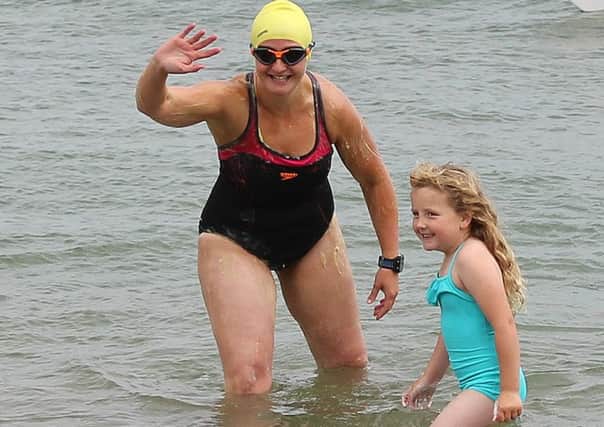 Heather Clatworthy with daughter Lily before she began her 13 mile swim from Photo: Chris Holmes/PA Wire