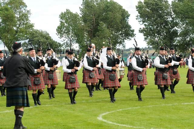 Pipe Major Robert Cupples (left in front row) and the PSNI Pipe Band pictured entering the competition arena at the Scottish Championships at Dumbarton