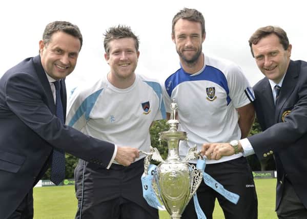 CSNI captain Andrew Cowden (second left) and his
CIYMS counterpart, Nigel Jones, with the managing director of AJG, Shane Matthews, and the president of the Northern Cricket Union, Peter McMorran