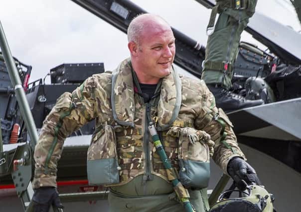 Air Commodore Harvey Smyth steps down from a Tornado strike fighter